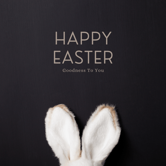 Happy Easter banner- White bunny ears appearing at the bottom -solid black background