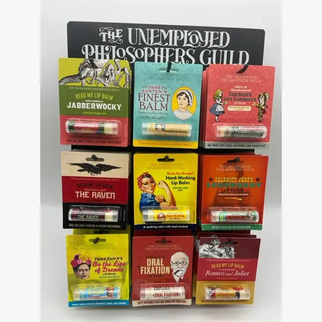 Collection of lip balm packages with various designs and text on a white background