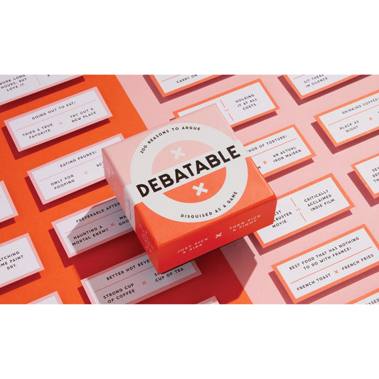 A box of debatable card game set upon a background of orange repetitive cards