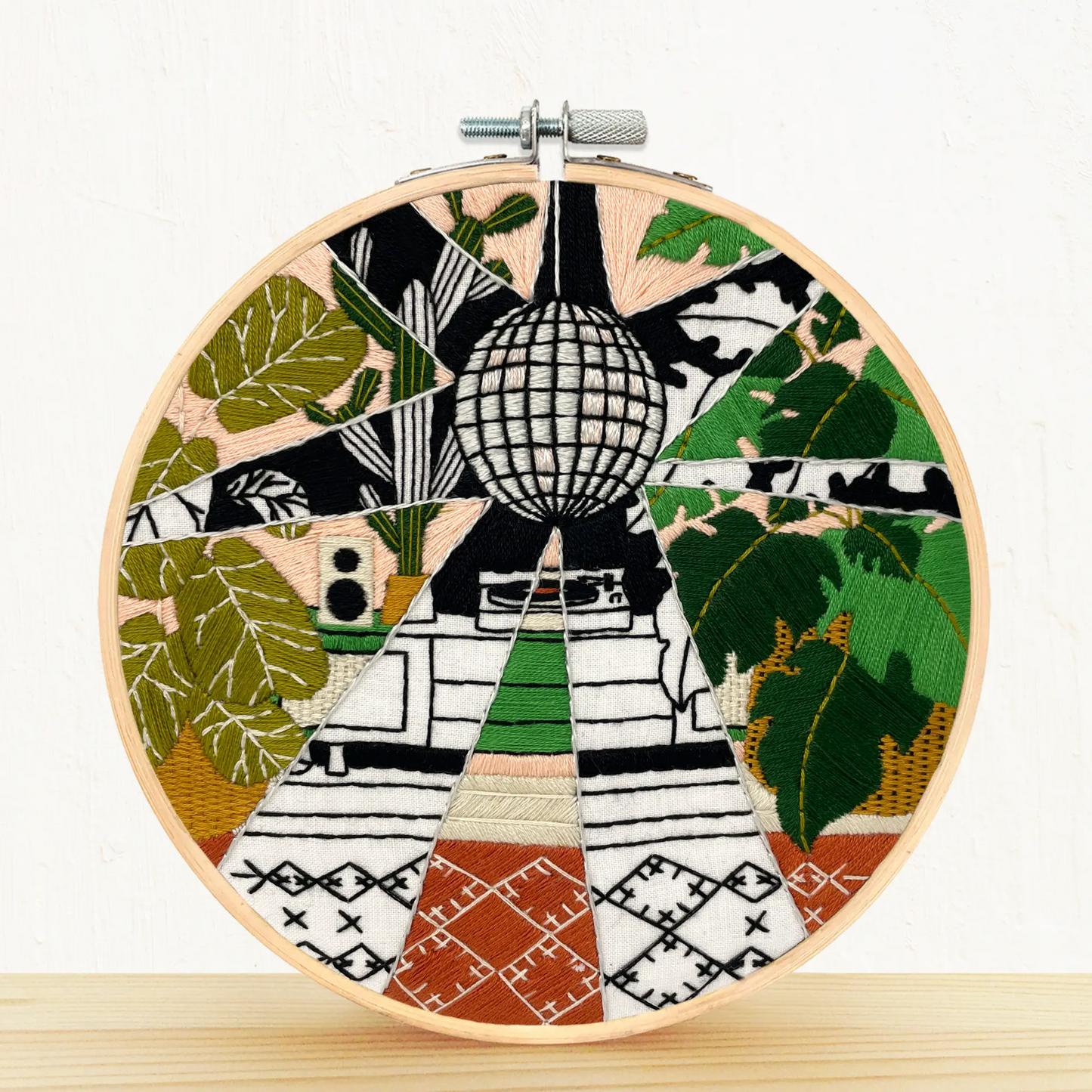 Embroidery DIY Craft hoop displaying finished sample of- Disco Plants design
