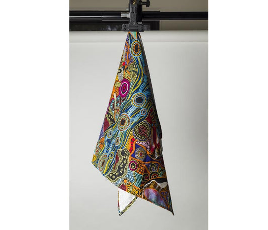 Teatowel- Australian indigenous art by Justin Butler hanging on a clip.