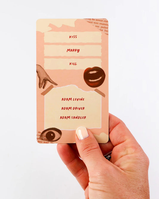 Hand holding a small card with text and illustrations on a white background