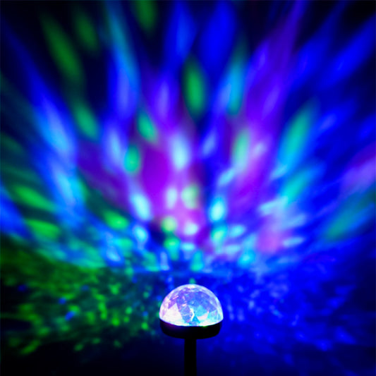 Colorful disco ball with vibrant light effects on a dark background