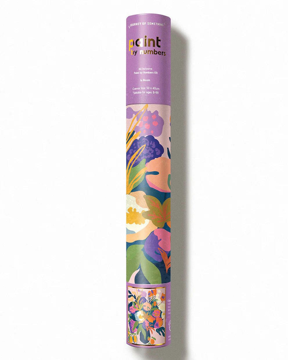 Floral-patterned paint tube with 'paint by numbers' branding on a white background