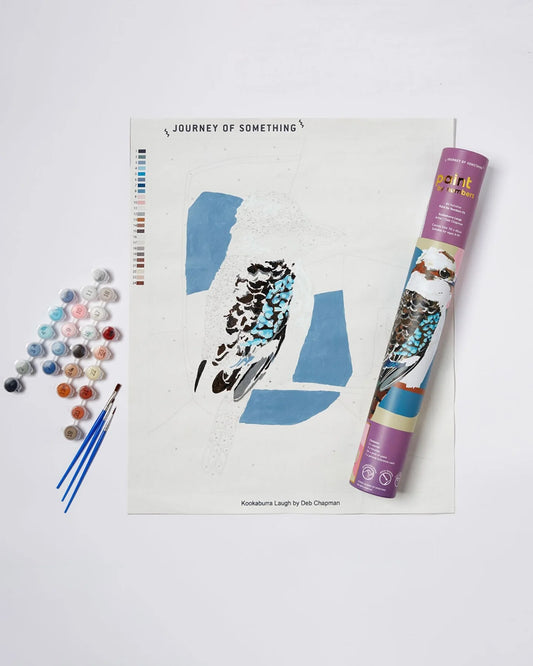 Artistic painting set with a book titled 'Journey of Something' on a white background