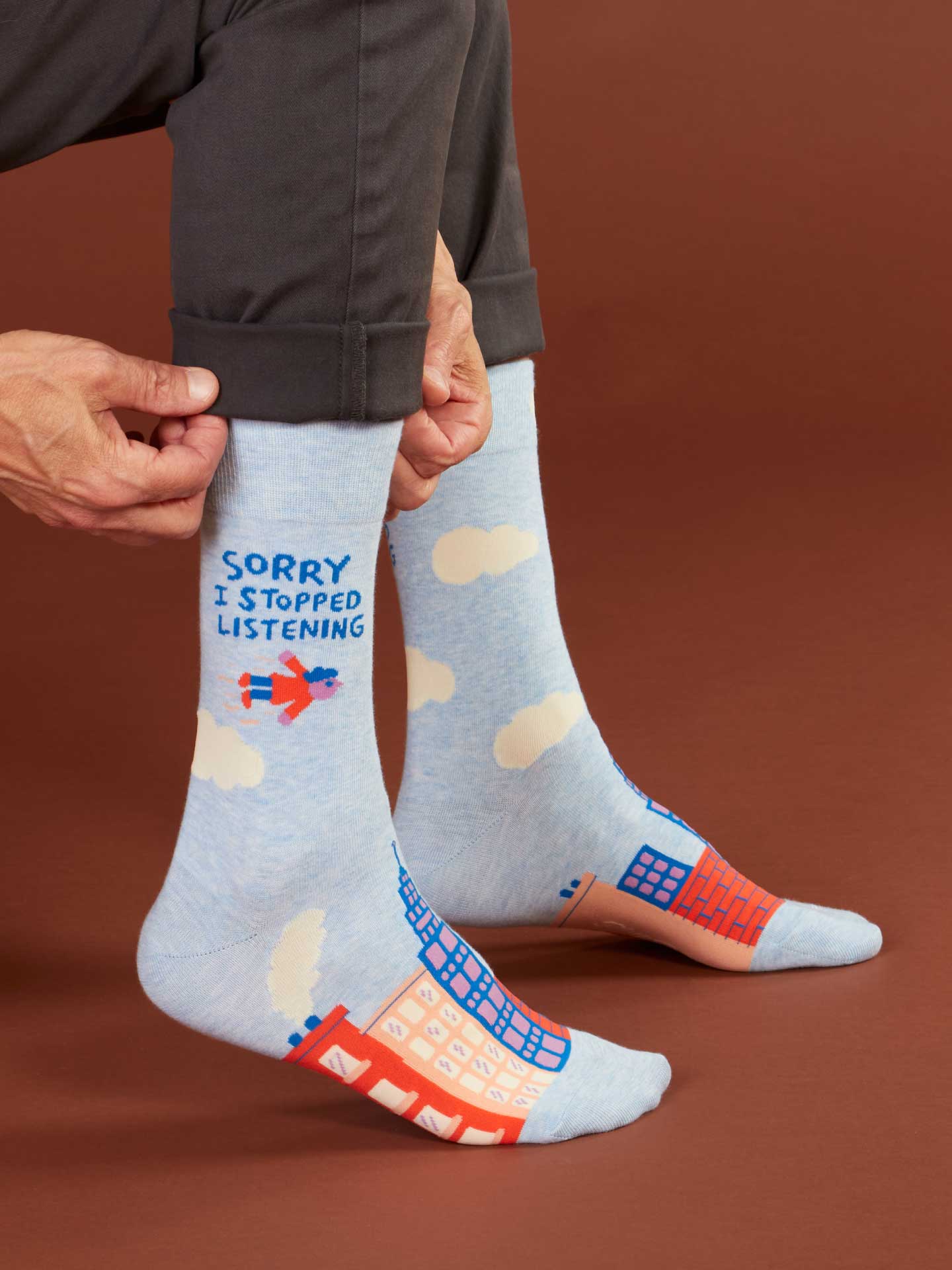 blue socks with text and patterns on a brown background