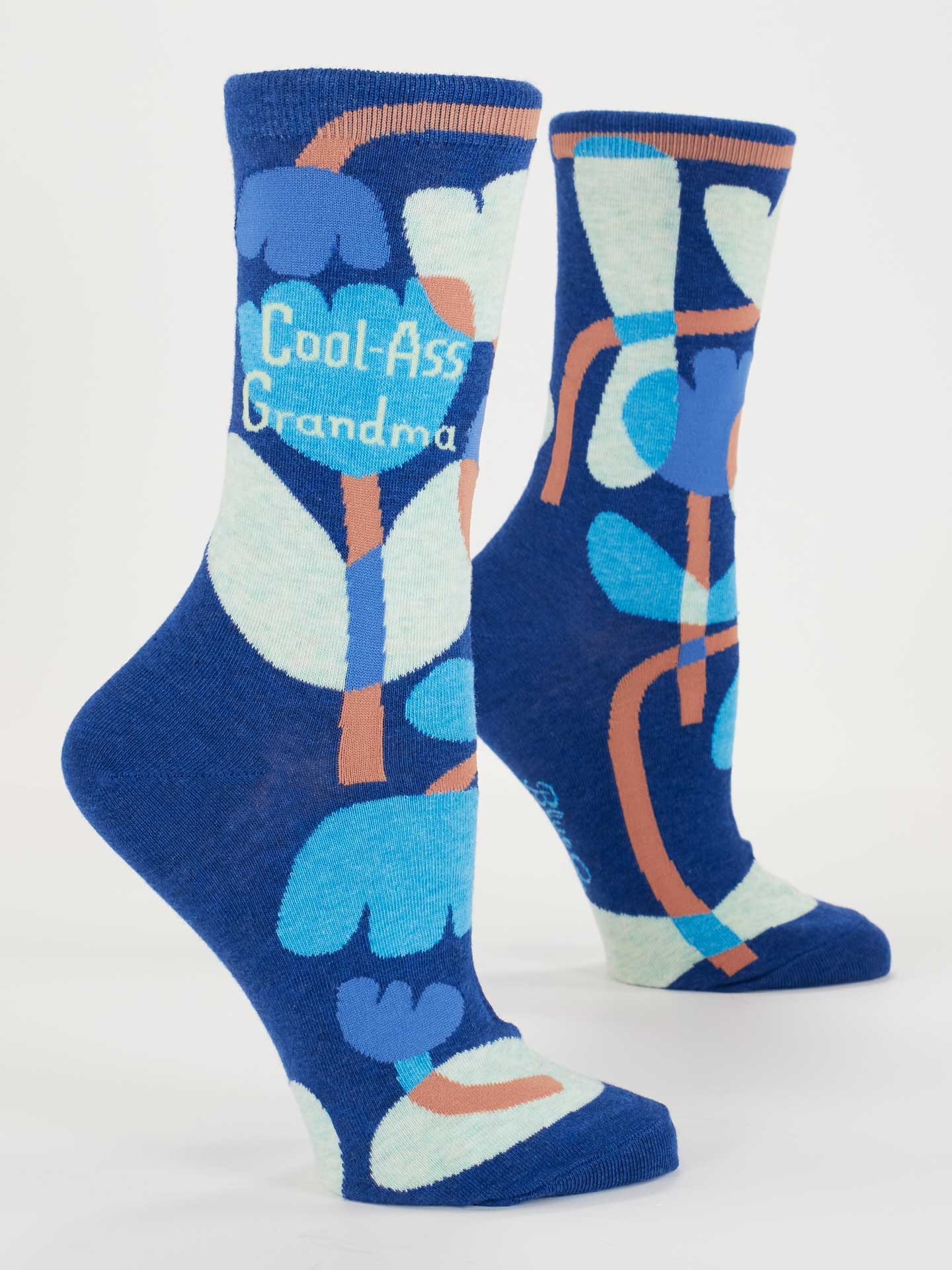Blue socks with floral design and 'Cool-Ass Grandma' text on a white background