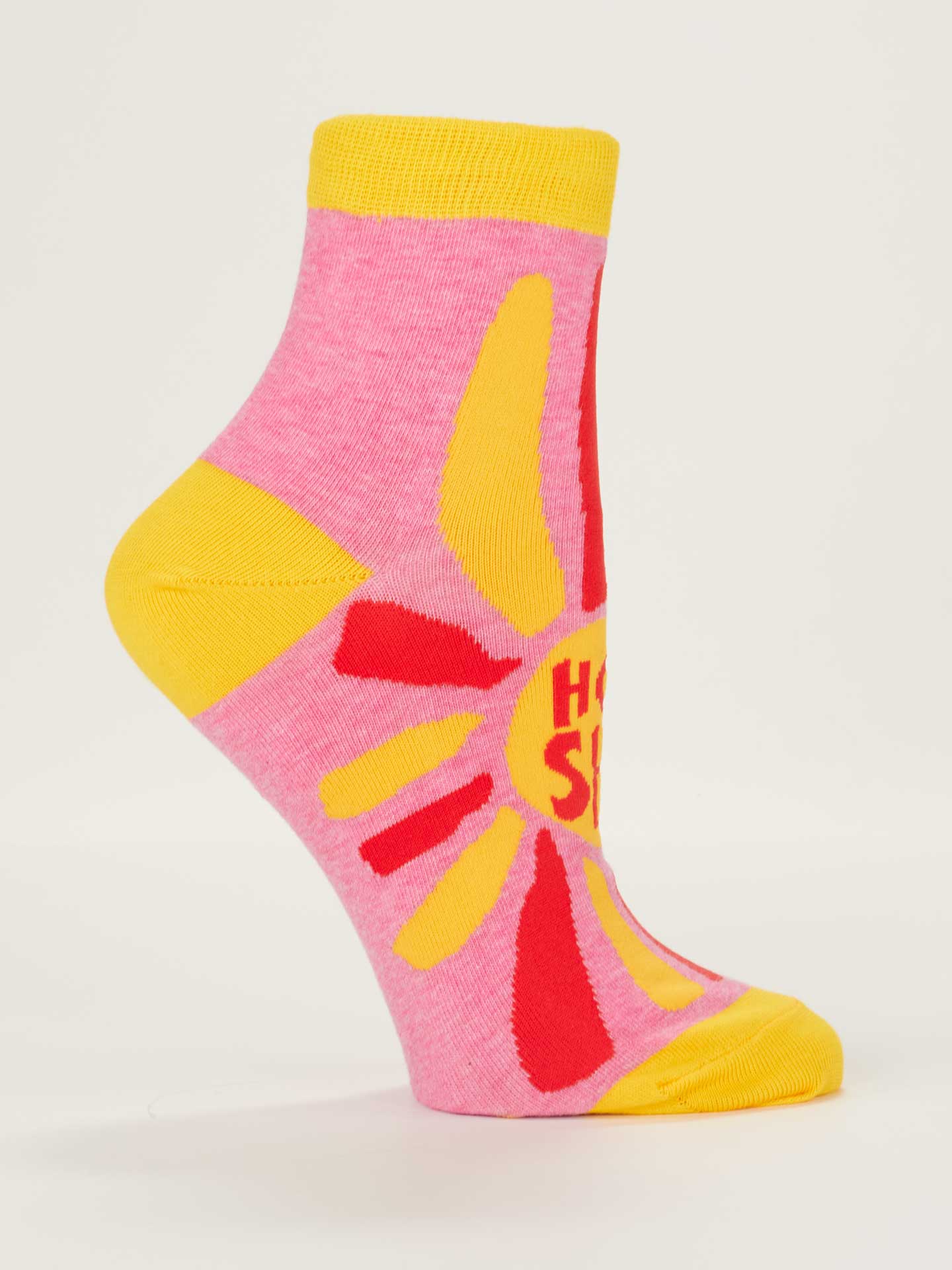 Pink sock with yellow accents and a red sun design on a white background