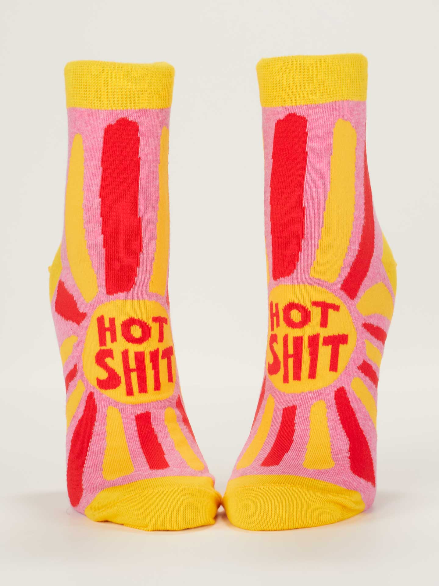 Colorful socks with red and yellow text on a white background