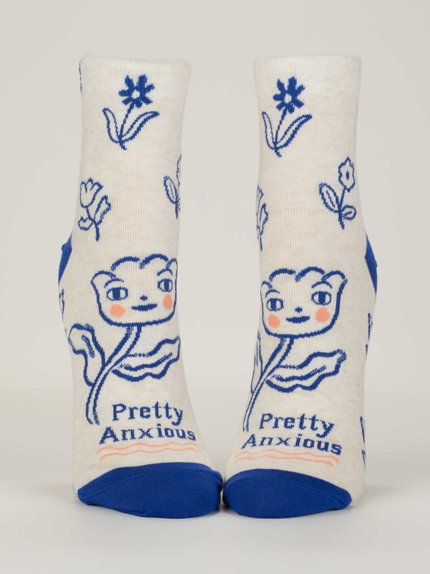 Pair of socks with floral design and 'Pretty Anxious' text on a white background