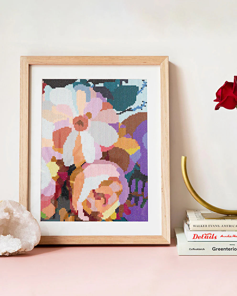 Framed sparkle "Blue Moon" artwork with colorful floral design on a white background