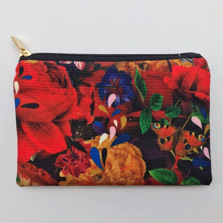 Back view Voglio Bene designer purse. Image is of vibrant floral arrangement with a butterfly in the lower right corner.
