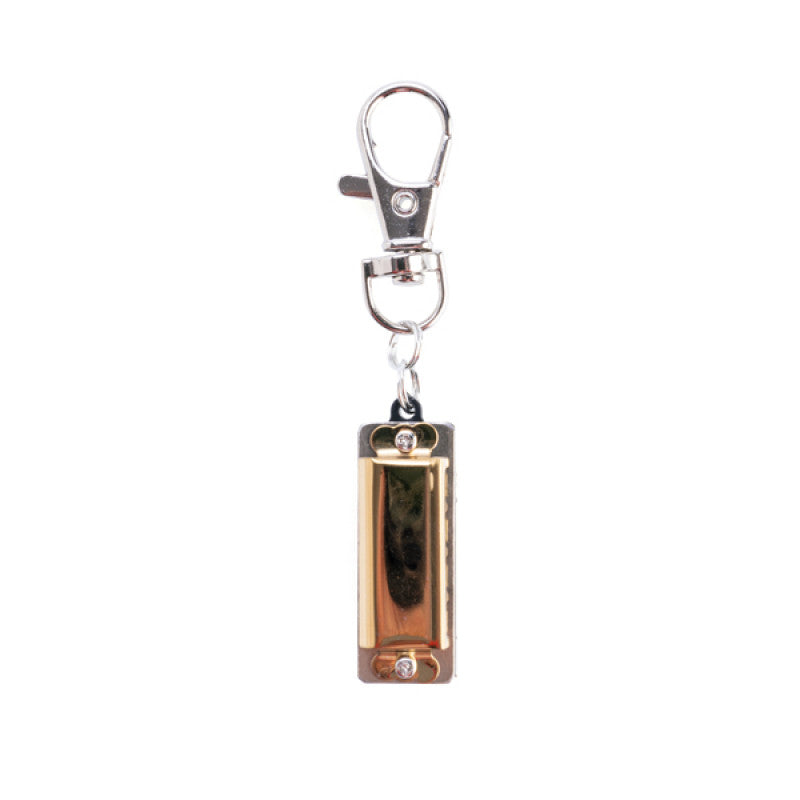 World's smallest harmonica with keyring on a white background