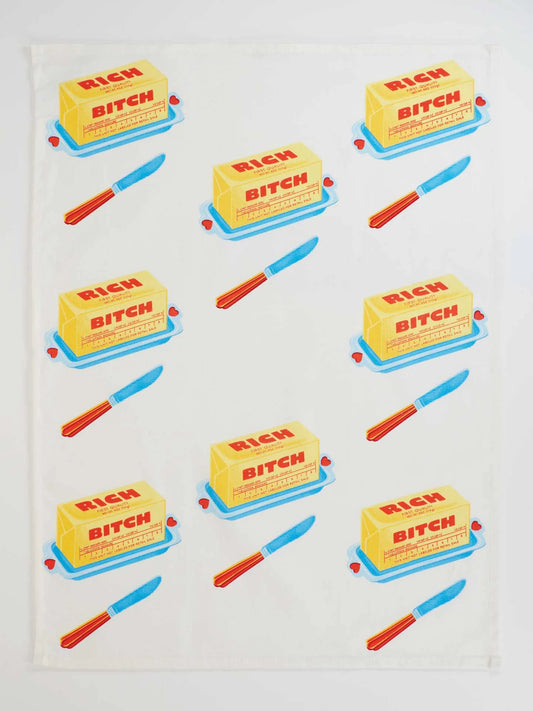 Pattern of butter with 'Rich Bitch' text on a white background