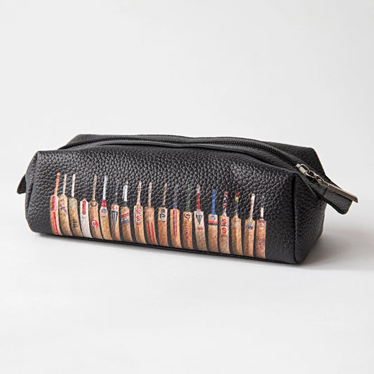 Black leather pouch with vintage-style cricket bats arranged in a row on a white background