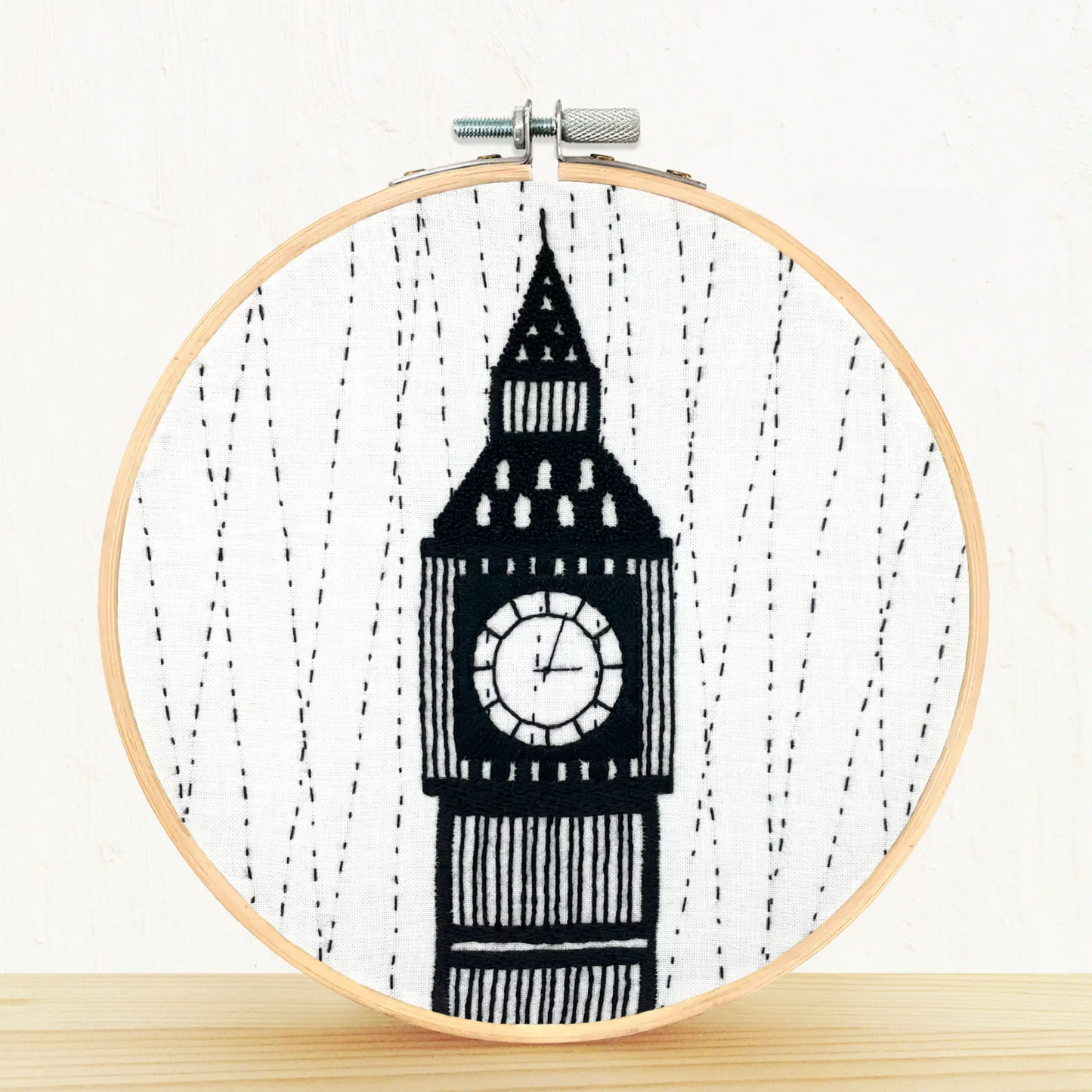 Finished black and white embroidery hoop on shelf displaying Big Ben clock-tower of London