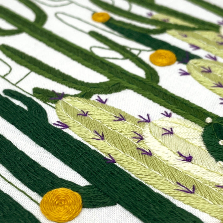 Closeup of the embroidery needlepoint of the cactus bloom design