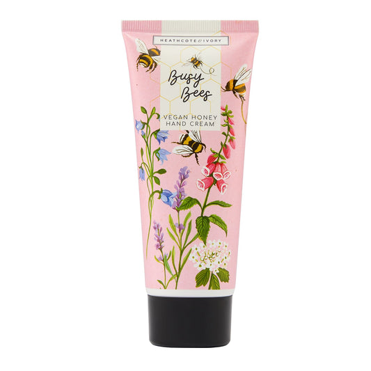 Hand cream tube with floral design and bee illustrations on a white background