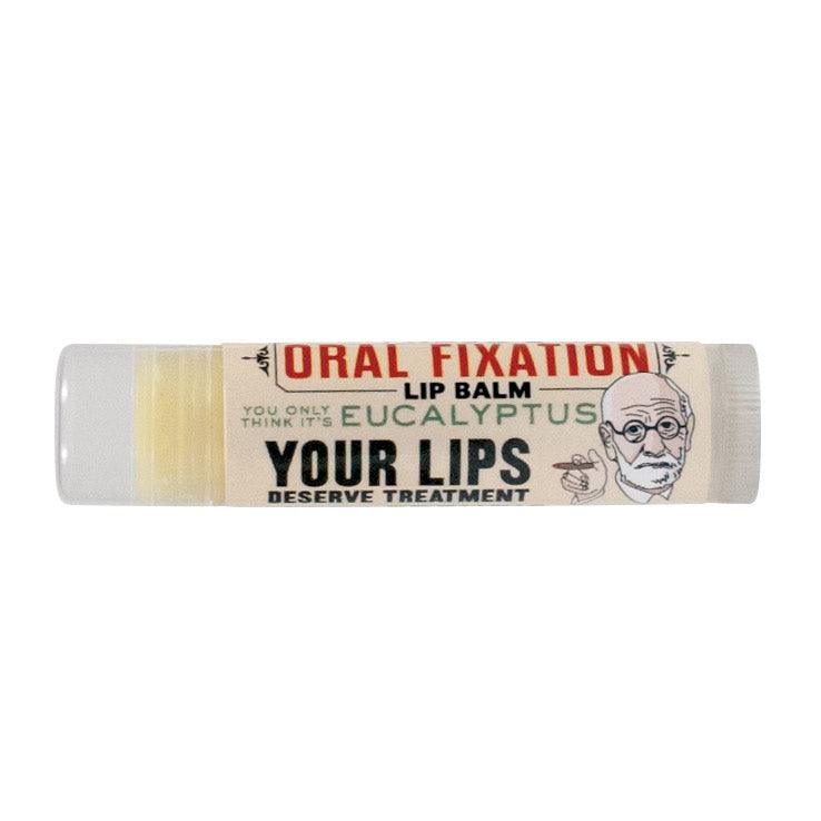 Lip balm stick with 'Oral Fixation' branding on a white background