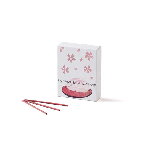Box of Sakurausagi incense with three sticks on a white background