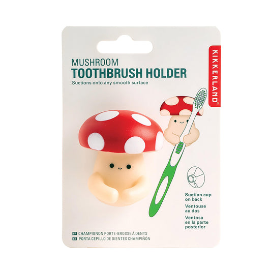 A Kikkerland Mushroom toothbrush holder on a header card on a white background.