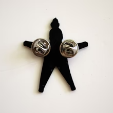 Back view enamel pin star-shaped with silver circular ends on a white background.