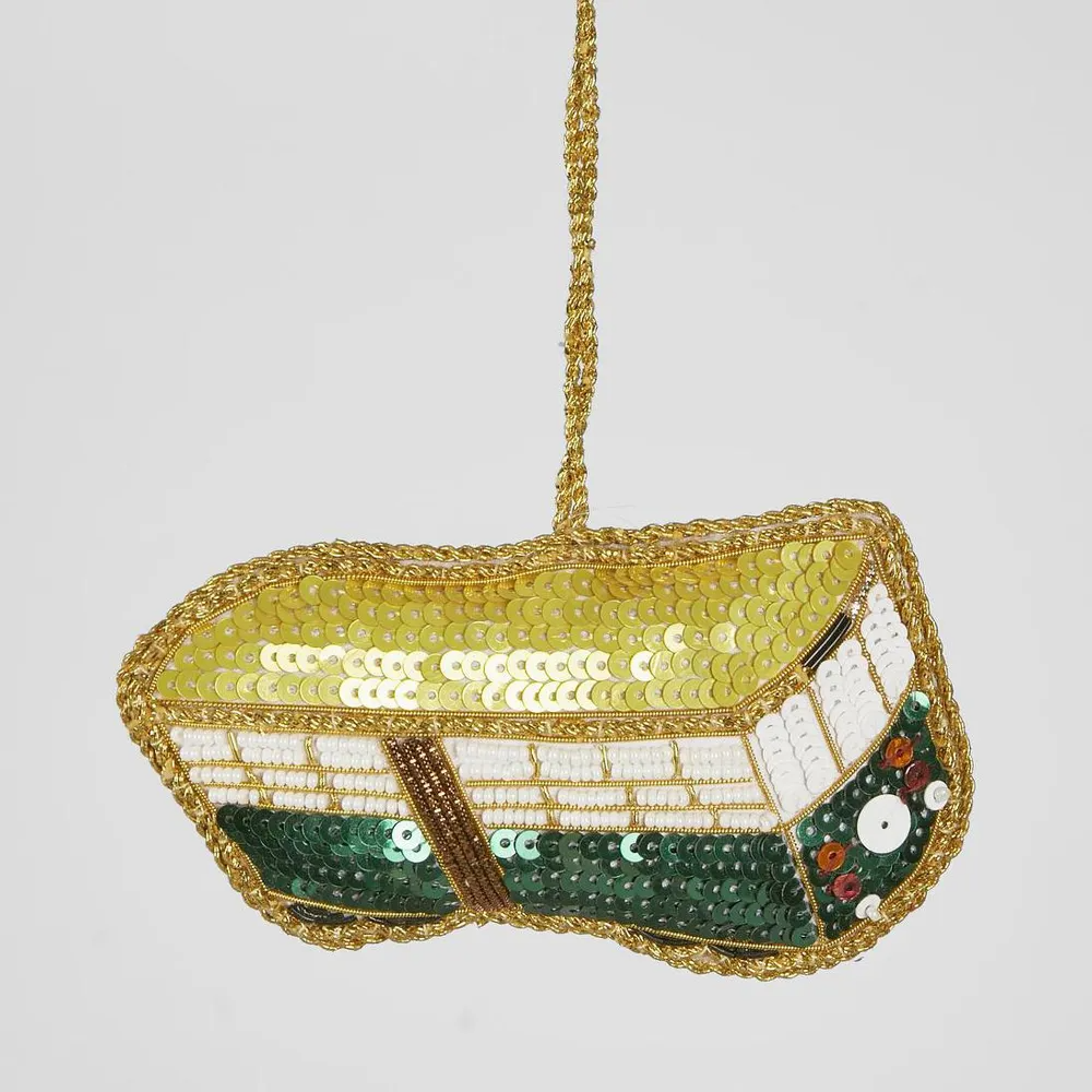 Decorative Melbourne tram tree decoration with sequins and beads on a light gray background