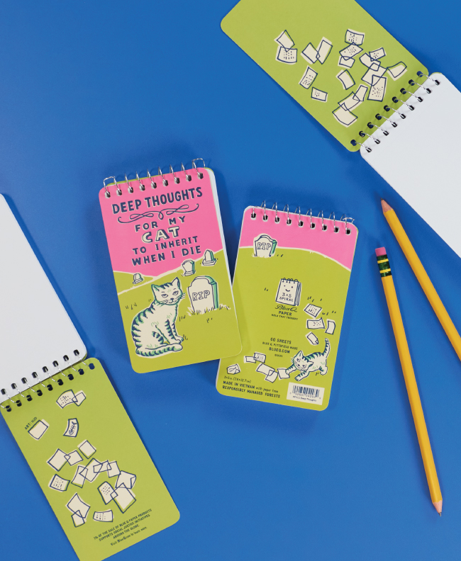 Several Deep Thoughts notepads ,two of which are opened flat on a bue background.