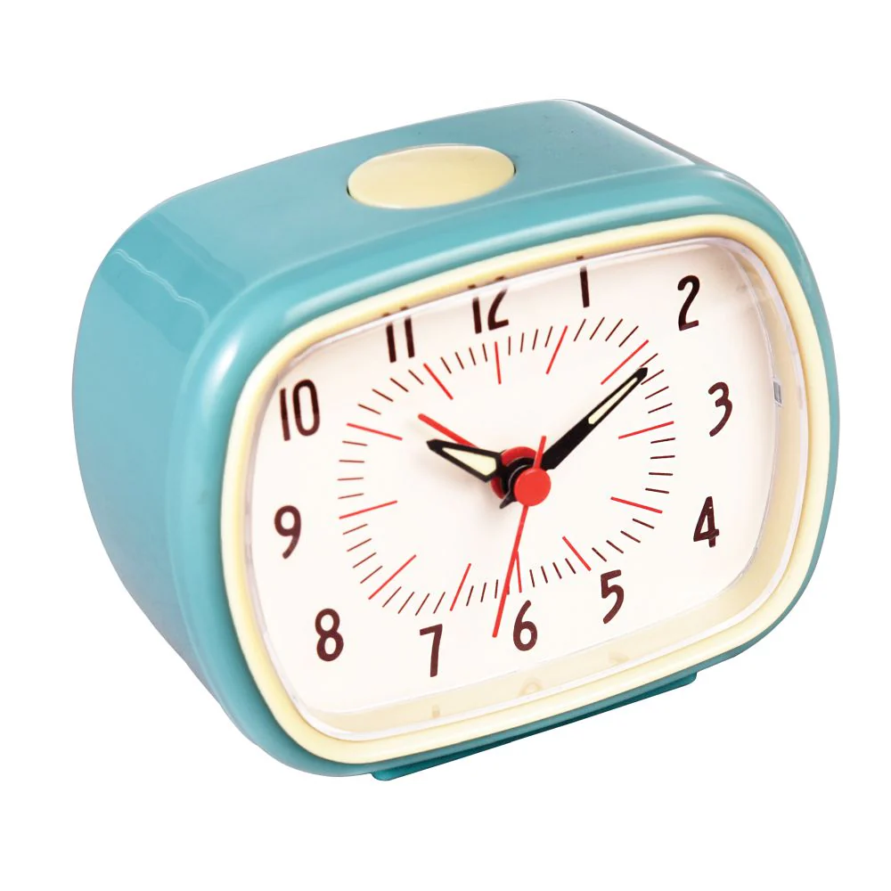 Teal alarm clock with a white face on a white background