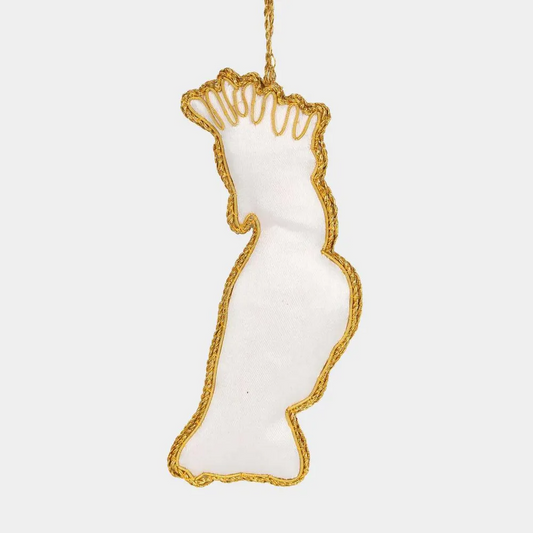 Back view of a Decorative ornament shaped like a cockatoo with gold embroidery on a white background