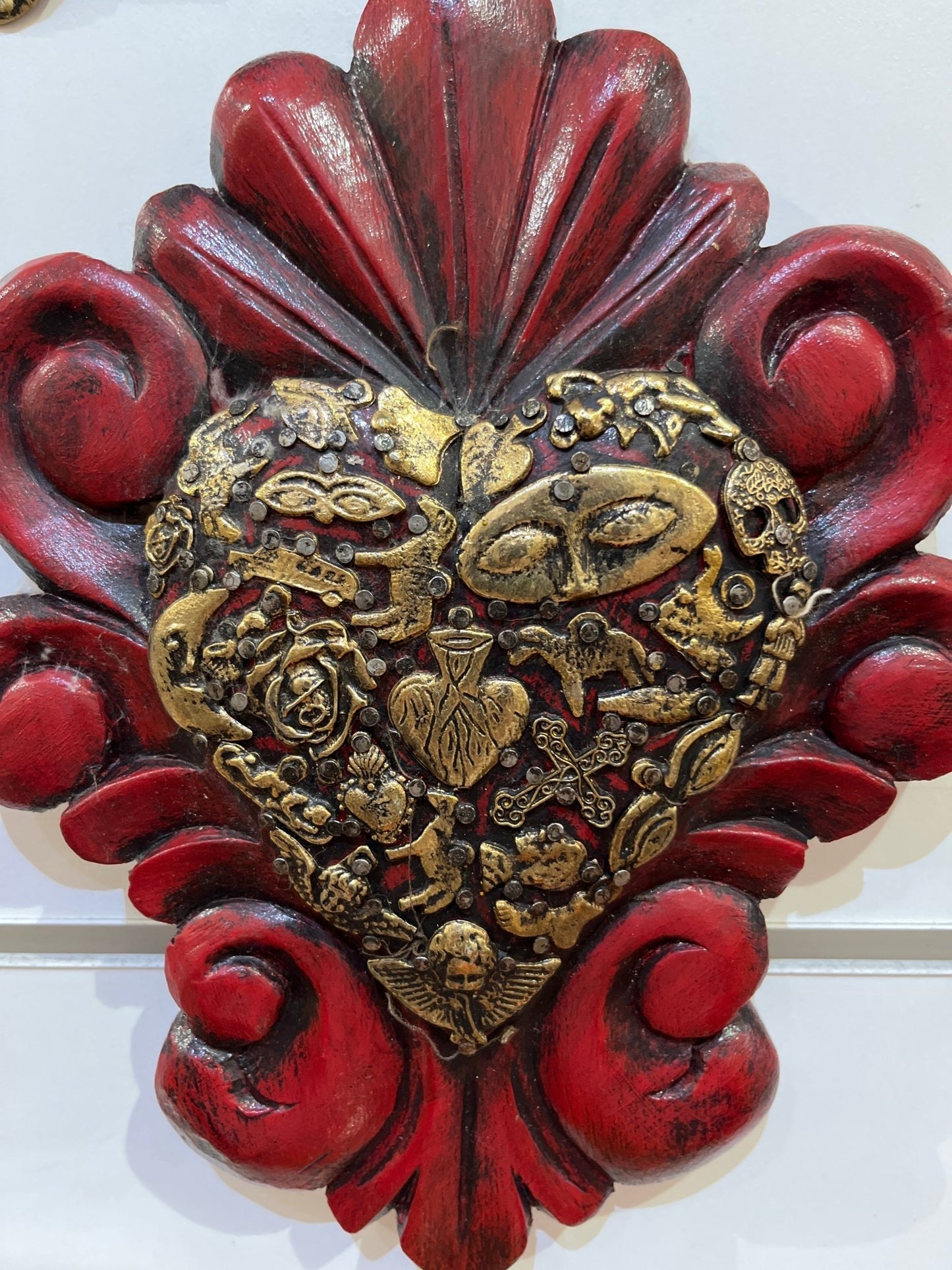 Mexican wall decoration - Wooden swirl carved heart with milagros charms - Gizmo Gifts