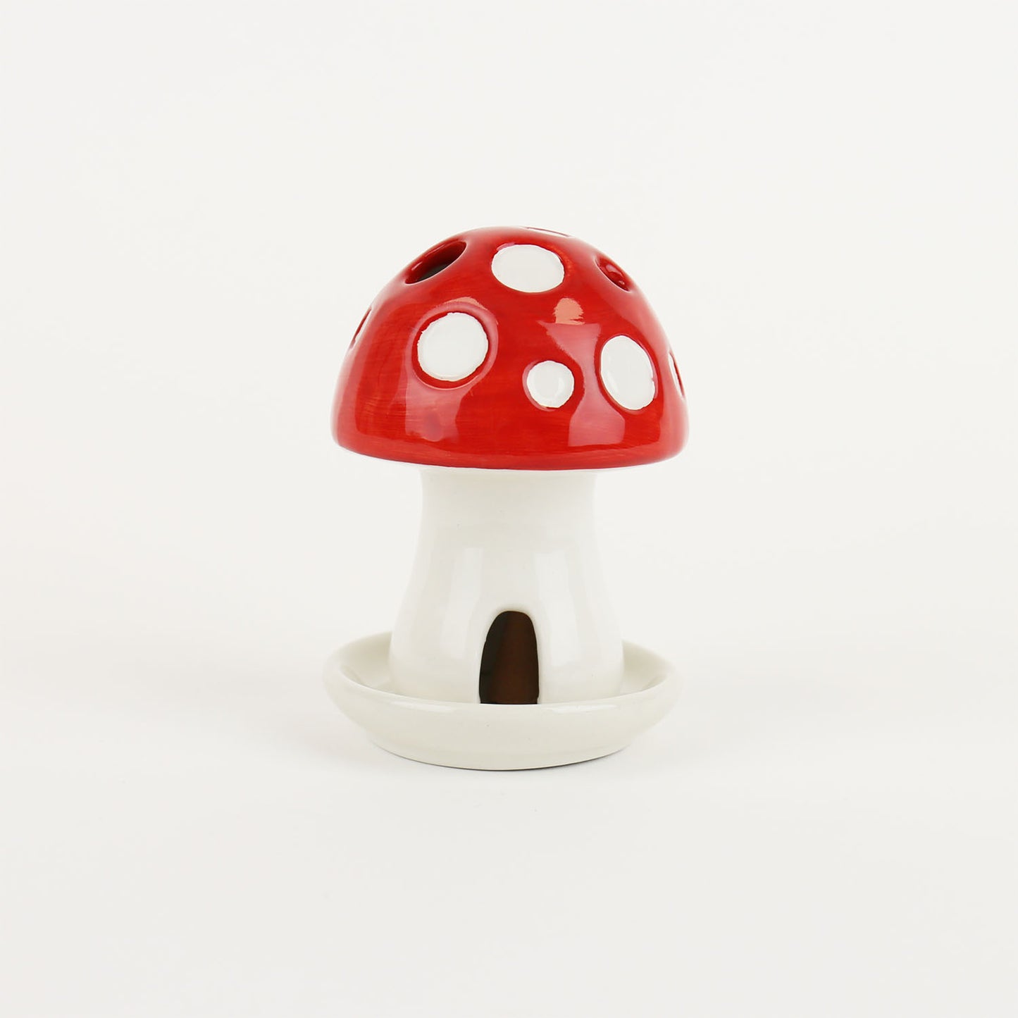 Mushroom house incense holder burner on a white background