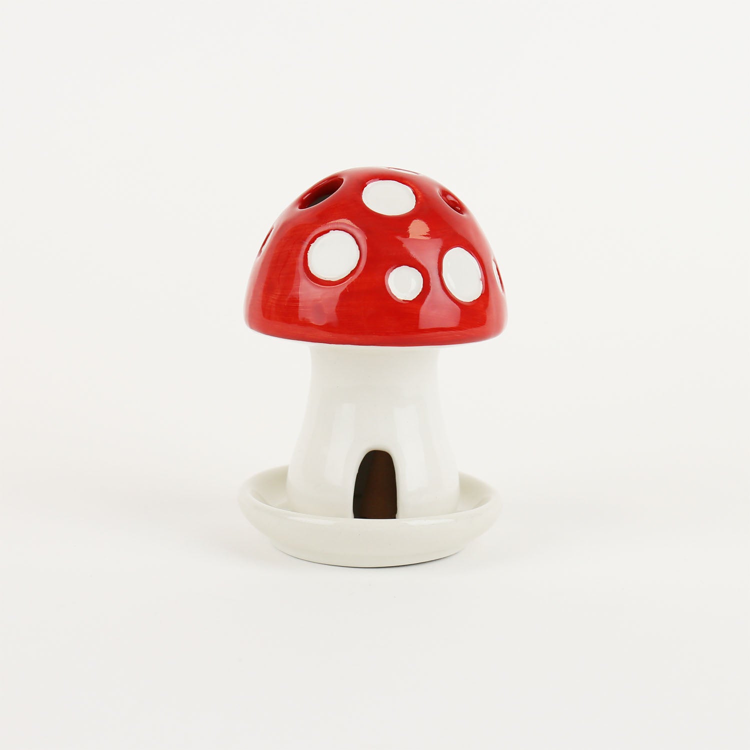 Mushroom house incense holder burner on a white background