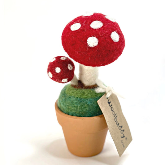 The back view of the Wool felt mushroom potted plant on a white background.