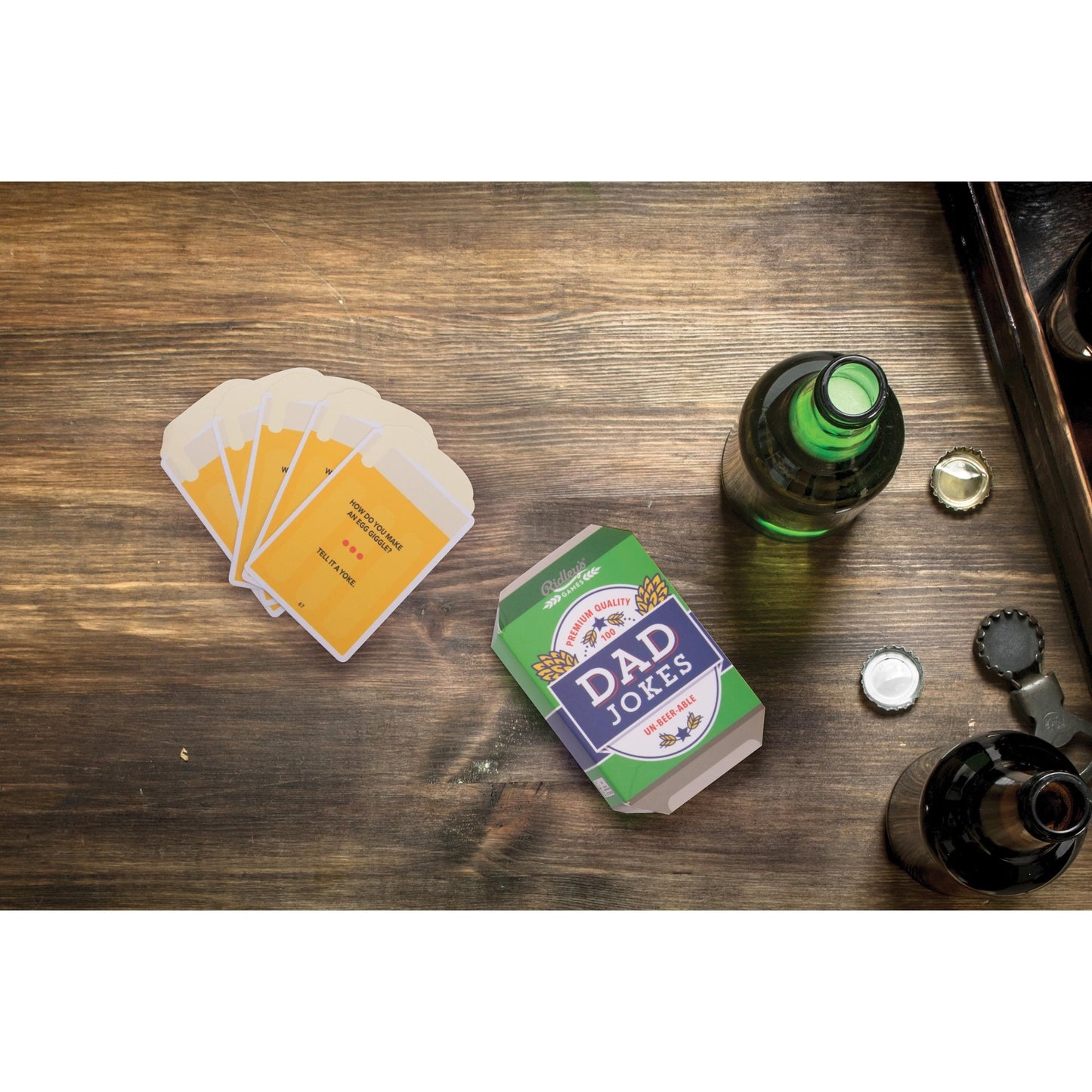 Ridley's Dad Jokes lifestyle picture beside open beer bottles