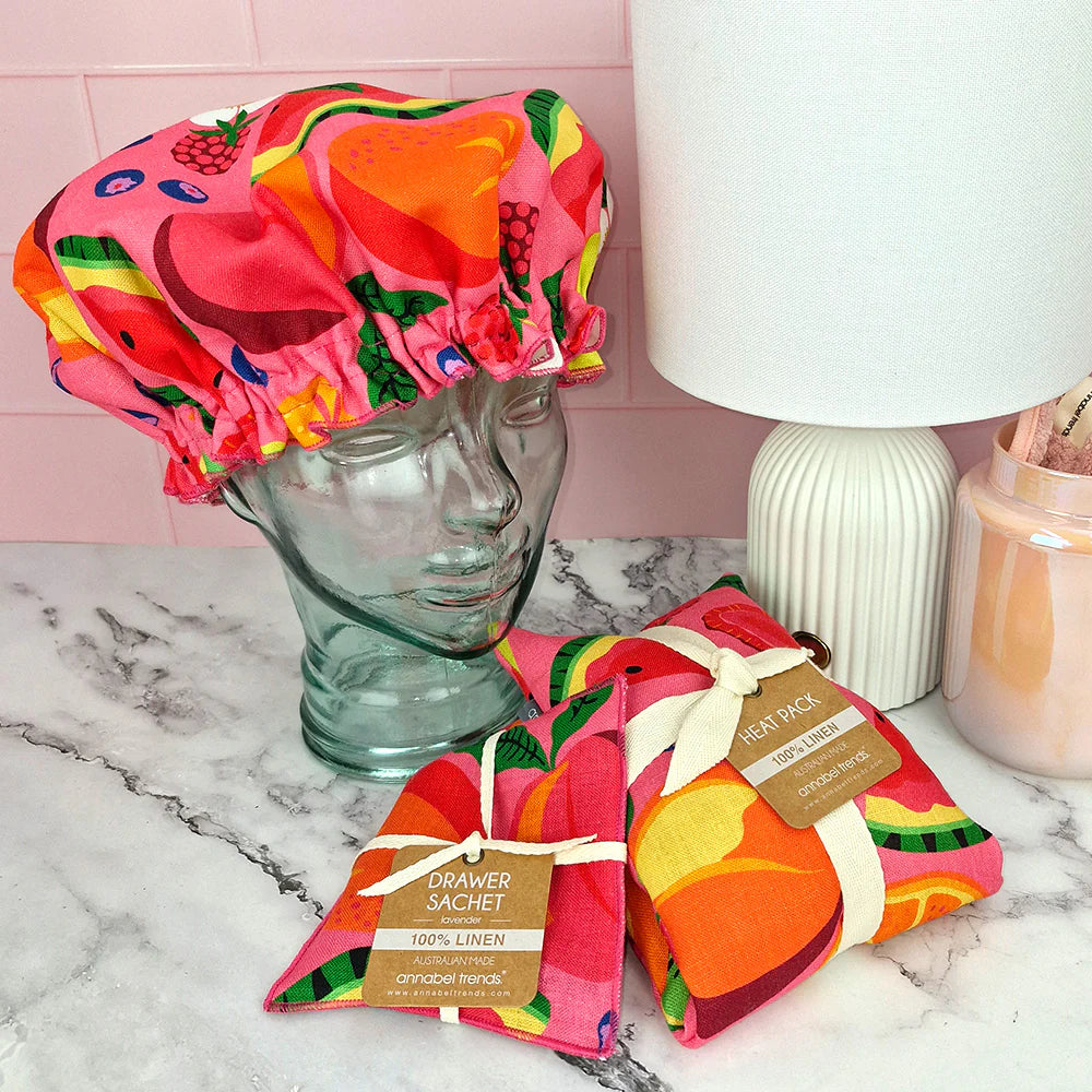 A lifestyle picture of Tropicana print beauty products from Annabel Trends.