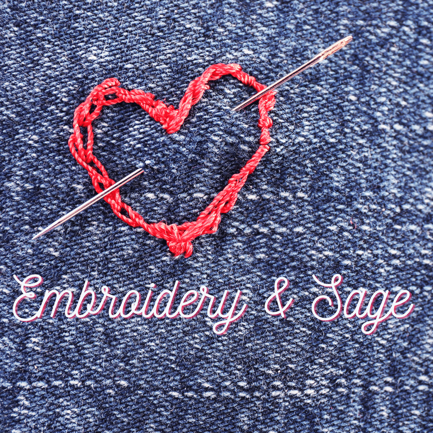 Denim background with an embroidered red heart and needle off centre, lower edge text is : Embroidery & Sage brand name