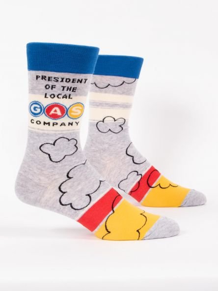 A pair of colourful Blue Q men's crew socks- Slogan reads: President of the local gas company , on a white background.- Gizmo Gifts