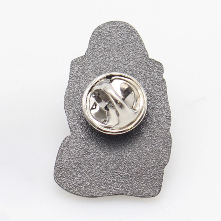 Back view:Metallic badge with a textured gray back on a white background