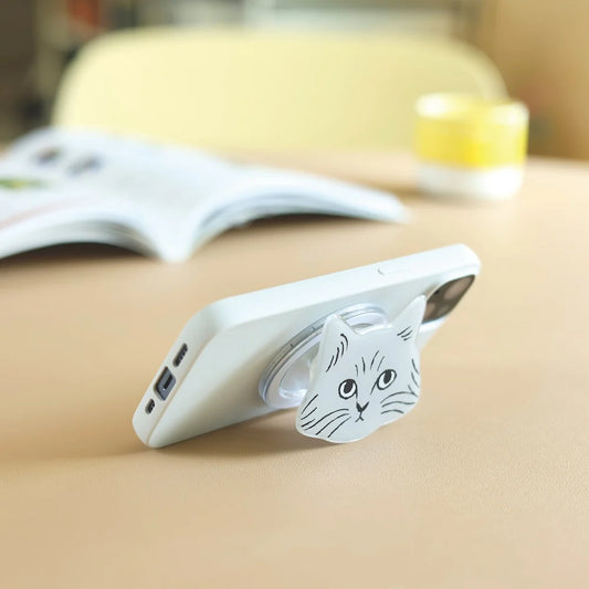Phone case with a cat design on a beige surface