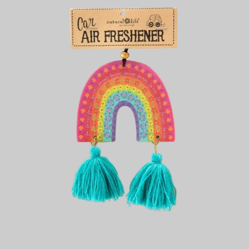 A colorful wooden rainbow-shaped air freshener with turquoise tassel drops, displayed on a kraft paper backing card labeled 'Car Air Freshener' by natural life.