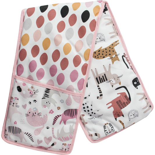 A pink hue double oven mitt features polka dots and many cats. It sits on a white background.