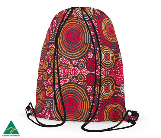 Drawstring bag featuring Aboriginal art of teddy Gibson on a white background.