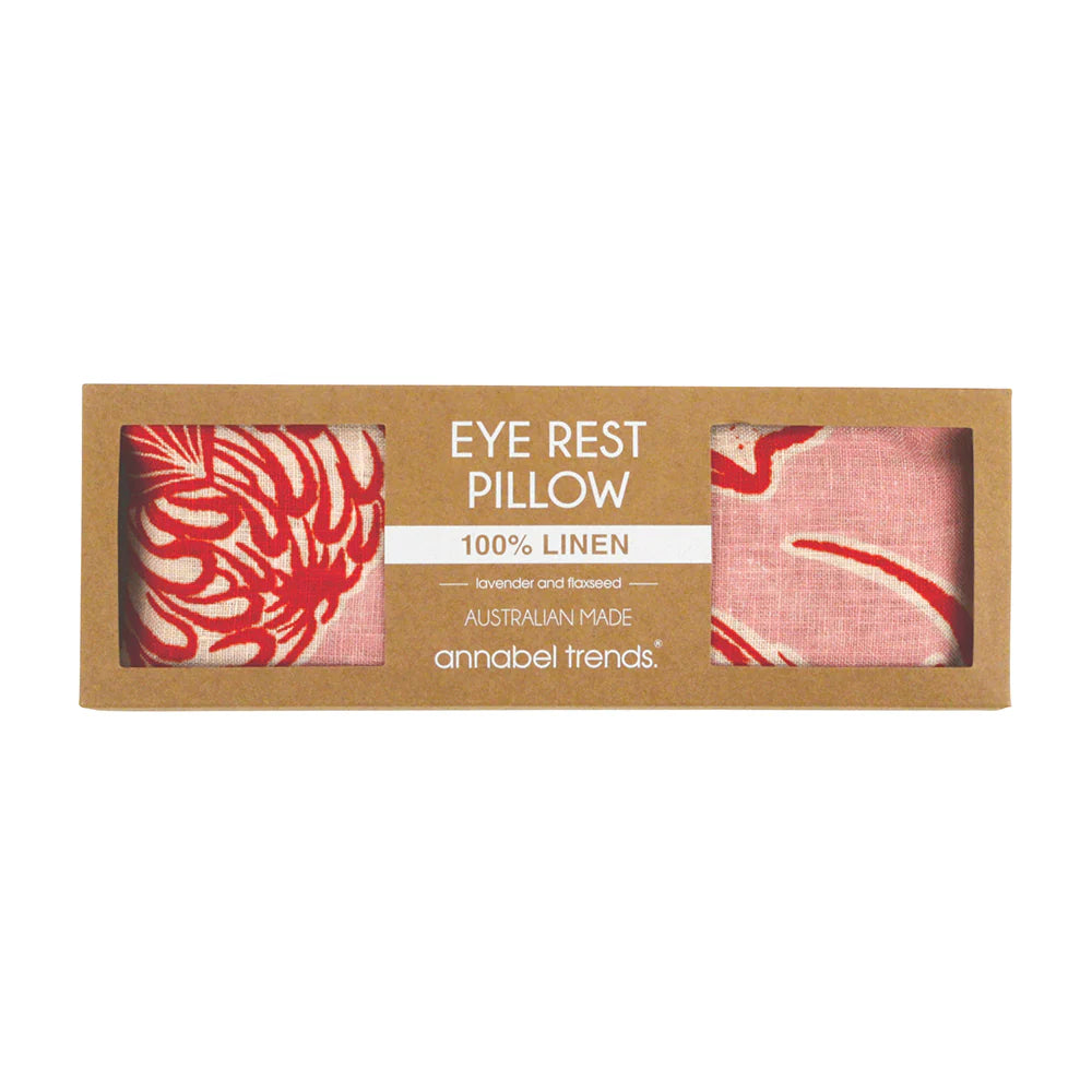 Eye rest pillow packaging with red and white design on a brown background