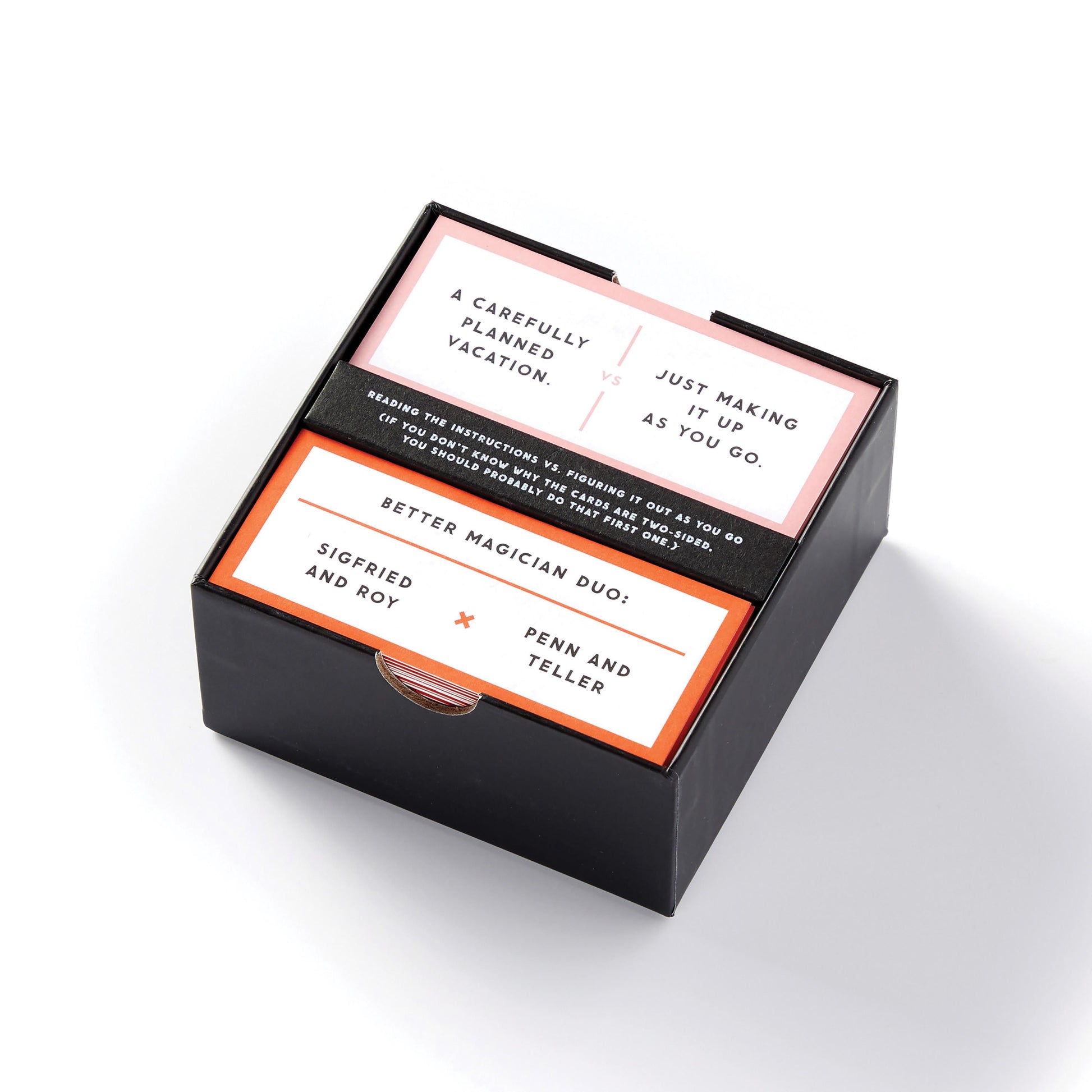 Black box with white and orange cards featuring magician names on a white background