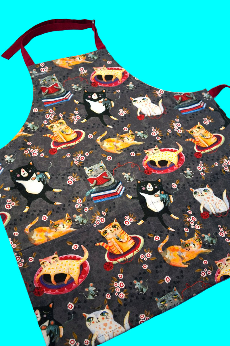 Apron with cat pattern on a blue background