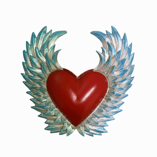 Heart-shaped Mexican wall decor with blue painted wing tips on a white background