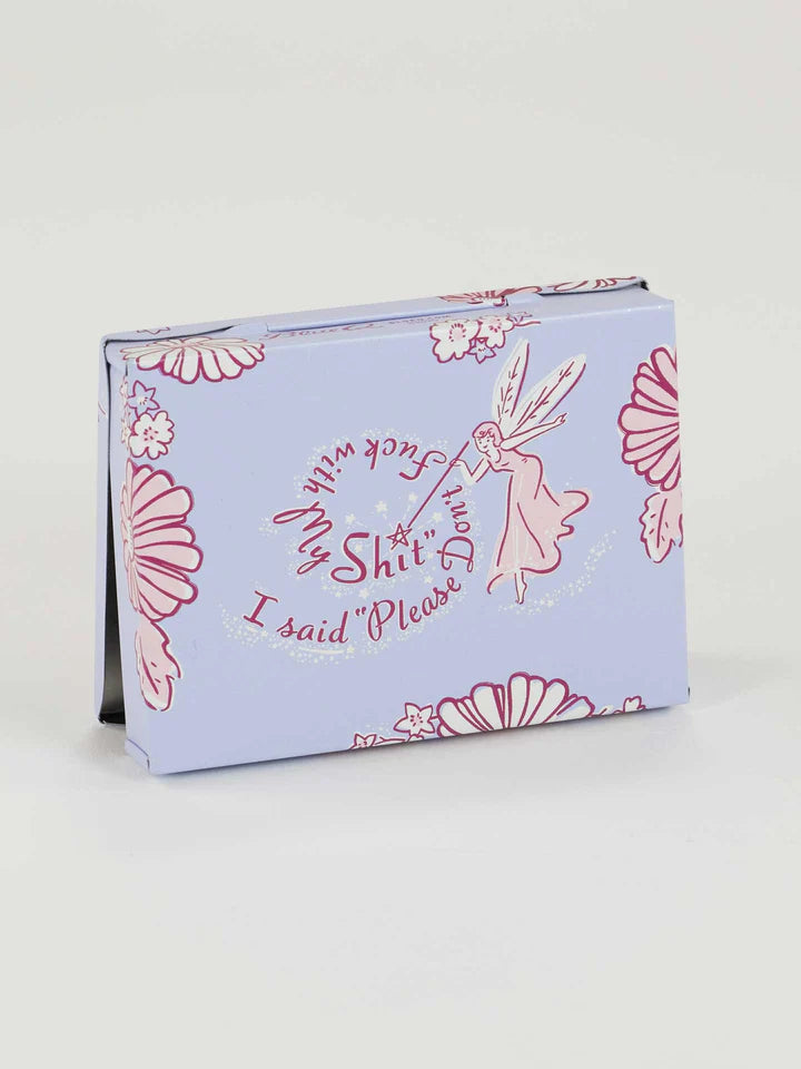 Back view tin pocket box with floral design and text on a light background