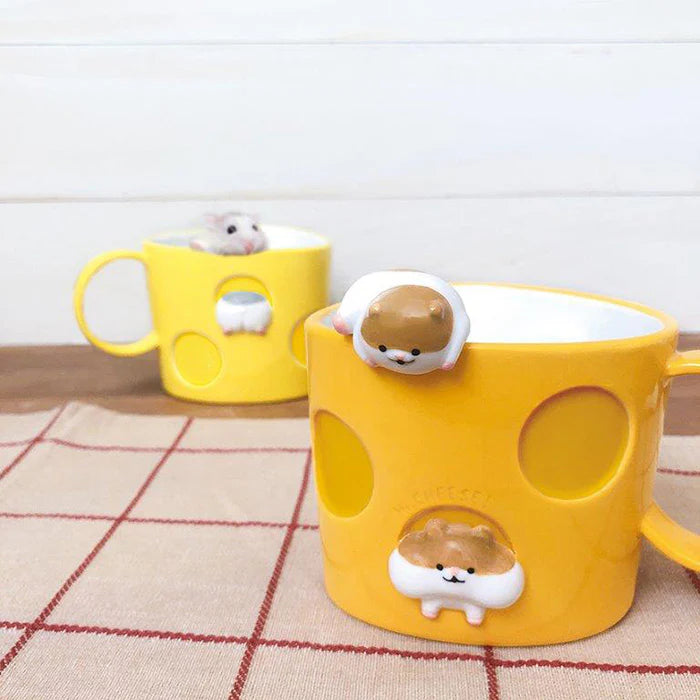 Yellow mugs with cute animal designs on a checkered tablecloth