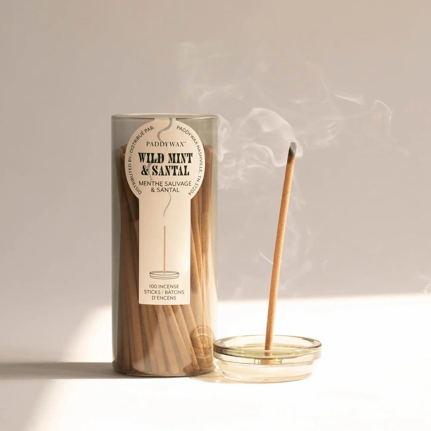 Incense sticks with packaging labeled 'Wild Mint & Santal' on a neutral background